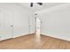 Clean bedroom with ceiling fan, wood-look floors, and freshly painted white walls at 1121 W Monroe Ave, Las Vegas, NV 89106