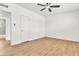Bright, white bedroom with modern ceiling fan and wood-look flooring at 1121 W Monroe Ave, Las Vegas, NV 89106