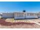 Charming single-story home with a stone-accented front, light gray exterior, and secure windows at 1121 W Monroe Ave, Las Vegas, NV 89106