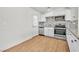 Well-lit kitchen featuring stainless steel appliances, granite countertops, and white cabinetry at 1121 W Monroe Ave, Las Vegas, NV 89106