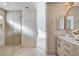 Bathroom showcasing a walk-in shower with a double vanity featuring stylish fixtures at 1506 Camino Summit Ave, Henderson, NV 89012