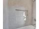 Tiled shower and bathtub combination with a built-in niche for convenient storage at 1506 Camino Summit Ave, Henderson, NV 89012