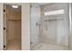 Modern bathroom featuring a glass-enclosed shower with unique tile work and a view into the walk-in closet at 1506 Camino Summit Ave, Henderson, NV 89012