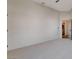 Spacious bedroom with plush carpeting and a view into the ensuite bathroom at 1506 Camino Summit Ave, Henderson, NV 89012
