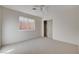 Neutral bedroom with carpet, ceiling fan, and closet at 1506 Camino Summit Ave, Henderson, NV 89012
