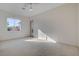 Bright bedroom featuring neutral carpet, a window with natural light, and a door to the hallway at 1506 Camino Summit Ave, Henderson, NV 89012