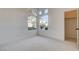 Sunlit bedroom with a closet and large windows offering views of the neighborhood at 1506 Camino Summit Ave, Henderson, NV 89012