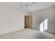 Light bedroom with ceiling fan, closet, and natural light at 1506 Camino Summit Ave, Henderson, NV 89012