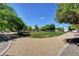 Picturesque neighborhood park featuring mature shade trees, and scenic walking paths at 1506 Camino Summit Ave, Henderson, NV 89012