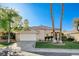Charming single-story home featuring a manicured lawn, mature trees, and a well-maintained driveway at 1506 Camino Summit Ave, Henderson, NV 89012
