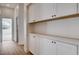 Hallway featuring built-in cabinets with a countertop, offering ample storage space at 1506 Camino Summit Ave, Henderson, NV 89012