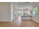 Well-lit kitchen with stainless appliances, and a bar counter, providing a seamless transition to the living area at 1506 Camino Summit Ave, Henderson, NV 89012
