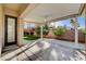 Outdoor patio with covered seating area and landscaped garden at 1506 Camino Summit Ave, Henderson, NV 89012