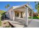 Charming covered patio with a view of the yard and palm trees at 1506 Camino Summit Ave, Henderson, NV 89012