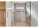 Modern walk-in shower featuring stylish tilework, glass enclosure, and a convenient built-in niche at 1506 Camino Summit Ave, Henderson, NV 89012