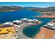 Stunning aerial view of waterfront homes surrounded by a tranquil lake and mountain scenery at 1596 Pleasant Bay Ct, Henderson, NV 89011