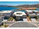 Picture-perfect aerial view showcasing modern homes on waterfront property with mountain views, and beautiful lake views at 1596 Pleasant Bay Ct, Henderson, NV 89011