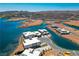 Aerial view of contemporary homes on waterfront property; scenic lake and mountain backdrop at 1596 Pleasant Bay Ct, Henderson, NV 89011