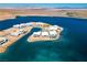 Stunning aerial view of the luxury home community along the water's edge with mountain views at 1596 Pleasant Bay Ct, Henderson, NV 89011