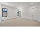 Open bedroom with neutral carpet, white walls and lots of natural light at 1596 Pleasant Bay Ct, Henderson, NV 89011