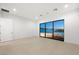 Bright bedroom with lake view and ample natural light from large windows at 1596 Pleasant Bay Ct, Henderson, NV 89011