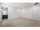Open bedroom with neutral carpet and a connecting bathroom at 1596 Pleasant Bay Ct, Henderson, NV 89011