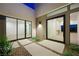 Inviting courtyard with sleek lines, low-maintenance landscaping, and contemporary architectural details at 1596 Pleasant Bay Ct, Henderson, NV 89011