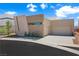 Contemporary home featuring a unique architectural design, modern landscaping, and neutral color palette at 1596 Pleasant Bay Ct, Henderson, NV 89011