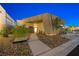 Contemporary home featuring desert landscaping and a stylish front entrance with walkway at 1596 Pleasant Bay Ct, Henderson, NV 89011