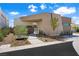 Modern home showcasing a stylish entrance, xeriscaping, and desert-friendly landscaping at 1596 Pleasant Bay Ct, Henderson, NV 89011