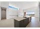 Bright, open kitchen features a large island, modern finishes, and a view at 1596 Pleasant Bay Ct, Henderson, NV 89011