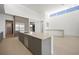 Open-concept kitchen with a large island, stainless steel appliances, and modern design at 1596 Pleasant Bay Ct, Henderson, NV 89011