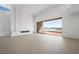 Bright open living area with neutral colors, modern design, fireplace and access to an outdoor view at 1596 Pleasant Bay Ct, Henderson, NV 89011