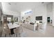Bright living and dining space featuring an open concept, modern design, and recessed lighting at 1596 Pleasant Bay Ct, Henderson, NV 89011