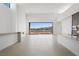 Bright open living area with neutral colors, a modern design, and access to an outdoor view at 1596 Pleasant Bay Ct, Henderson, NV 89011