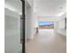 Bright, open-concept living room with tile floors, large windows, and modern design elements at 1596 Pleasant Bay Ct, Henderson, NV 89011
