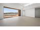 Bright open living area with neutral colors, modern design and sliding glass doors to the water at 1596 Pleasant Bay Ct, Henderson, NV 89011