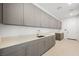 Well-lit pantry area with plenty of counter space, cabinets, and modern fixtures at 1596 Pleasant Bay Ct, Henderson, NV 89011