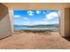Unfinished patio with lake view and clear skies, an open canvas for relaxation at 1596 Pleasant Bay Ct, Henderson, NV 89011