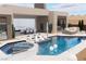 The pool area has many features and gives access to different parts of the house at 1596 Pleasant Bay Ct, Henderson, NV 89011