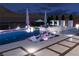 Enjoy these in-pool lounge chairs in this luxurious outdoor living space at 1596 Pleasant Bay Ct, Henderson, NV 89011