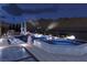 Elegant pool and spa with lounge chairs, ambient lighting, and a scenic mountain backdrop at 1596 Pleasant Bay Ct, Henderson, NV 89011