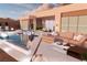Inviting poolside lounge area with modern outdoor seating, a pool, and a dining area at 1596 Pleasant Bay Ct, Henderson, NV 89011