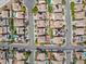 An overhead view shows many homes in a neighborhood with pools and lush landscaping at 1604 Patrick Thomas Ct, North Las Vegas, NV 89086