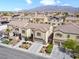 Aerial shot of townhouses with landscaping, solar panels, and desert landscaping at 1604 Patrick Thomas Ct, North Las Vegas, NV 89086