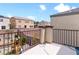 Upper balcony area overlooking a backyard play area with a play set and landscaped features at 1604 Patrick Thomas Ct, North Las Vegas, NV 89086