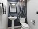 A quaint powder room features a pedestal sink, modern toilet, and decorative accents at 1604 Patrick Thomas Ct, North Las Vegas, NV 89086