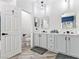 Bright bathroom with double sinks, modern vanity, and a separate toilet room at 1604 Patrick Thomas Ct, North Las Vegas, NV 89086