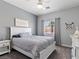 Comfortable bedroom features neutral colors, a cozy bed, and a calming atmosphere at 1604 Patrick Thomas Ct, North Las Vegas, NV 89086
