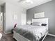 Serene bedroom boasts soft lighting, a comfortable bed, and minimalist decor for a calming retreat at 1604 Patrick Thomas Ct, North Las Vegas, NV 89086